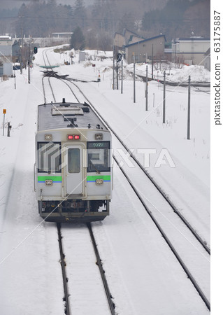 Shooting the scenery of a regular train arriving and departing from Kuromatsunai Station in Kuromatsunai Town, Hokkaido in early spring Shooting the scenery of a regular train arriving and departing from Kuromatsunai Station in Kuromatsunai Town, Hokkaido in early spring 63175887