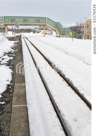Shooting scenery of JR Kobu Station in Rankoshi-cho, Hokkaido in early spring 63176439