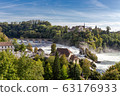 Rheinfall the large and powerful waterfall surround with green forest and blue sky background view from Neuhausen am Rheinfall railway station in switzerlad 63176933
