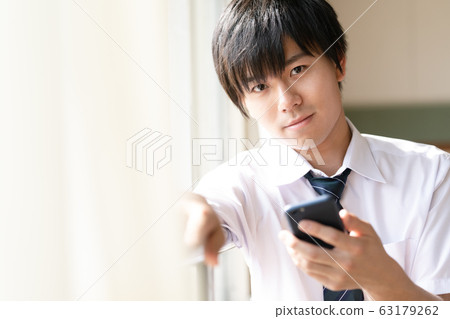 Male high school student smartphone 63179262