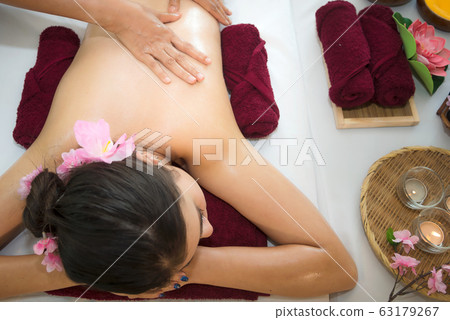 Woman spa body treatment and massage aroma therapy  63179267