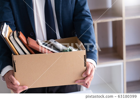 Sad Fired Young Employee businessmen hold boxes 63180399