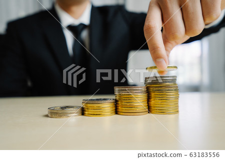 Businessman working with coin money currency. Businessman working with coin money currency. 63183556