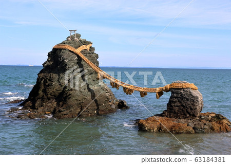Meoto Iwa "Married Couple Rocks" of Futami, in Mie Japan, a sacred Shinto island Meoto Iwa "Married Couple Rocks" of Futami, in Mie Japan, a sacred Shinto island 63184381