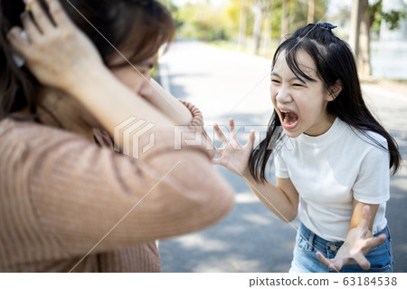 Angry child daughter shouting scolding at her mother about fussy things,nag,stressed girl screaming,girl is going crazy,losing control of emotions,concept of arguing,relationship,family life problems Angry child daughter shouting scolding at her mother about fussy things,nag,stressed girl screaming,girl is going crazy,losing control of emotions,concept of arguing,relationship,family life problems 63184538