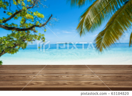 Brown wood table on summer tropical beach. 63184820