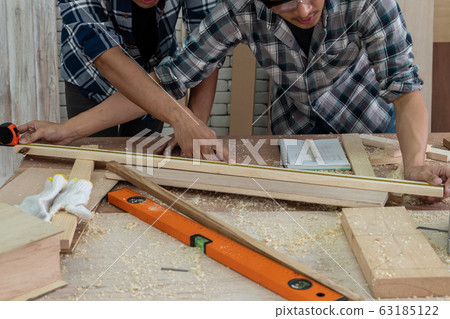 Carpenter working on wood craft at workshop Carpenter working on wood craft at workshop 63185122