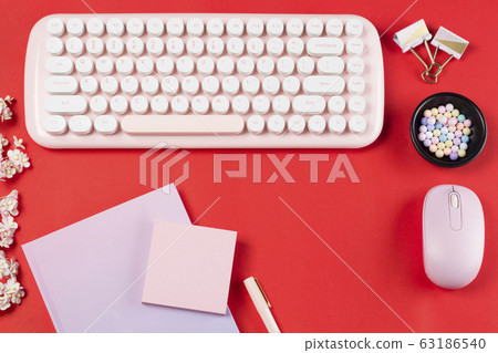 flat lay stationery on work desk in red pastel background flat lay stationery on work desk in red pastel background 63186540