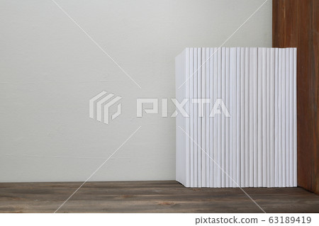 Stacked white books 63189419