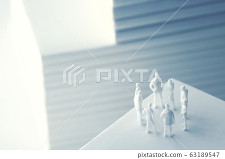 Stacked white books and human 63189547