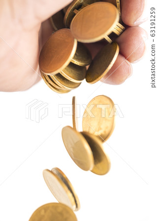 A group of golden coin falling down from bare hand 63191259