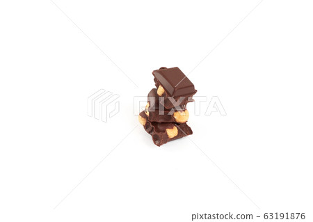 Chocolate pieces with nuts isolated on white background 63191876
