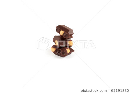 Chocolate pieces with nuts isolated on white background 63191880