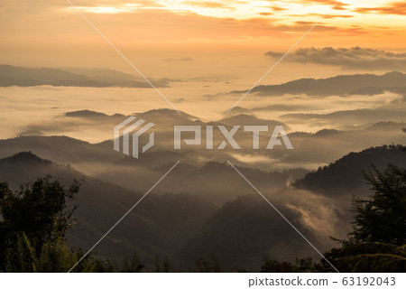 The fog covered the mountains range in Chiang Rai the province in northern region of Thailand in winter season. The fog covered the mountains range in Chiang Rai the province in northern region of Thailand in winter season. 63192043