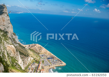 Paradise with mountain, sea, hotel and beach with transparent water Paradise with mountain, sea, hotel and beach with transparent water 63192050