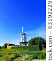 Windmills in European countryside 63192229