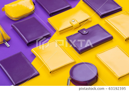 flat lay handmade purple and yellow purse on a matte table 63192395