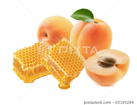 Apricots and honeycomb isolated on white background Apricots and honeycomb isolated on white background 63193264