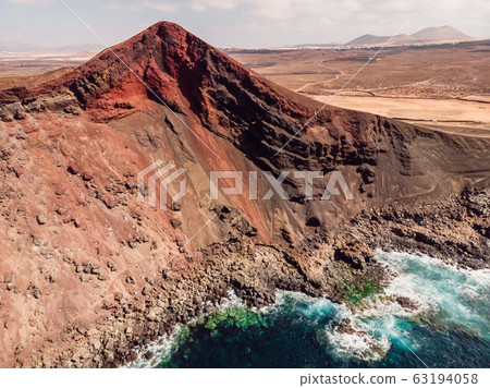 Volcanic crater with Atlantic ocean near La Santa, Lanzarote, Spain. Aerial view 63194058
