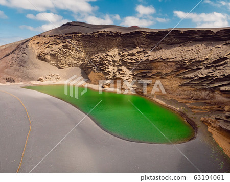 Volcanic crater with a green lake near El Golfo, Lanzarote, Spain. Aerial view 63194061