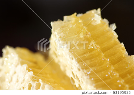 Honeycomb with liquid honey 63195925