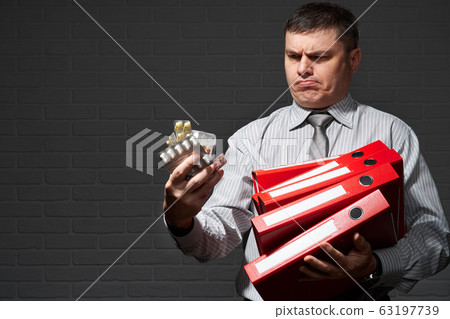 Very busy businessman closeup portrait, posing 63197739