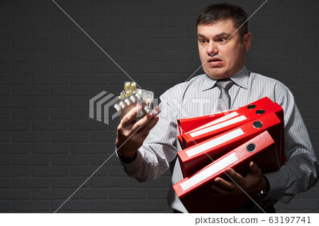 Very busy businessman closeup portrait, posing 63197741