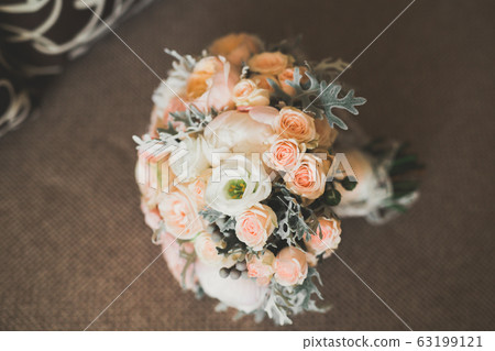 Beautiful wedding bouquet with different flowers, roses Beautiful wedding bouquet with different flowers, roses 63199121