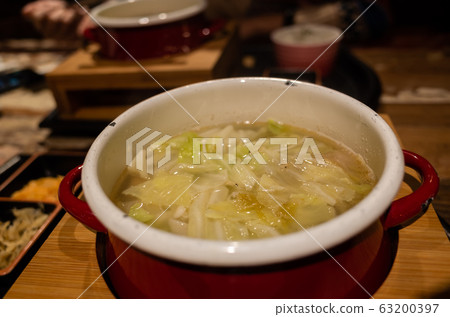 woman eating hot pot woman eating hot pot 63200397