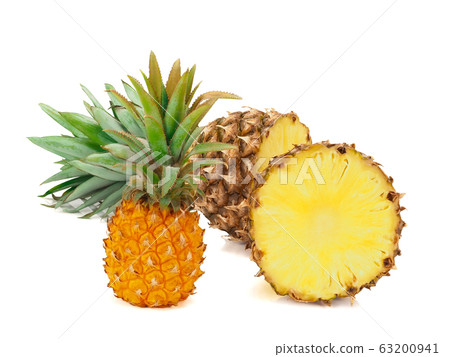 One whole baby pineapple with green leaves and two halves of pineapple isolated on white background One whole baby pineapple with green leaves and two halves of pineapple isolated on white background 63200941