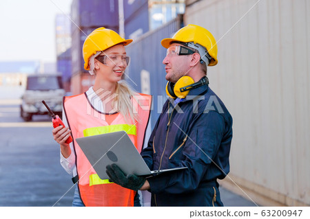 Worker man and woman discuss about their system and express happy emotion Worker man and woman discuss about their system and express happy emotion 63200947