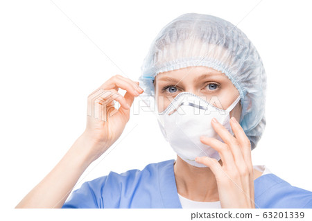 Putting respiratory mask on face 63201339