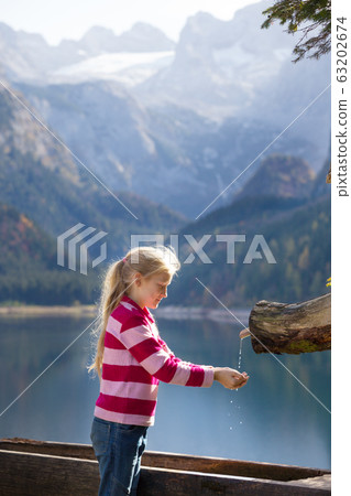 beautiful mountain lake and girl 63202674