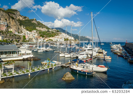 Amalfi harbor with lots of different type boats Amalfi harbor with lots of different type boats 63203284