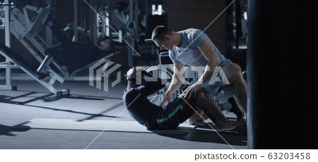 Wheelchair man exercising sit ups 63203458