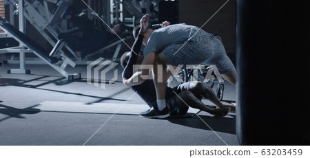 Wheelchair man exercising sit ups 63203459