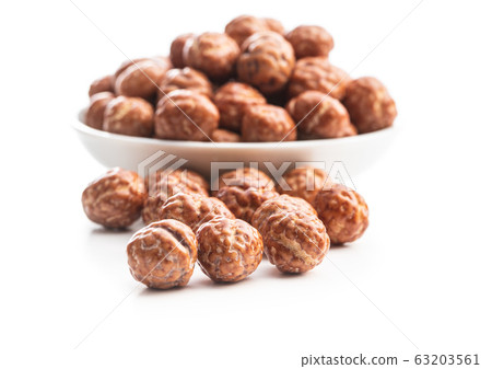 Hazelnuts with sugar icing. Hazelnuts with sugar icing. 63203561