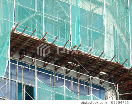 Catch platform or other construction projection from the face of a building. It is protect individuals and property from falling debris during construction.  63204795