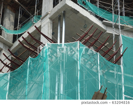 Catch platform or other construction projection from the face of a building. It is protect individuals and property from falling debris during construction. Catch platform or other construction projection from the face of a building. It is protect individuals and property from falling debris during construction. 63204816