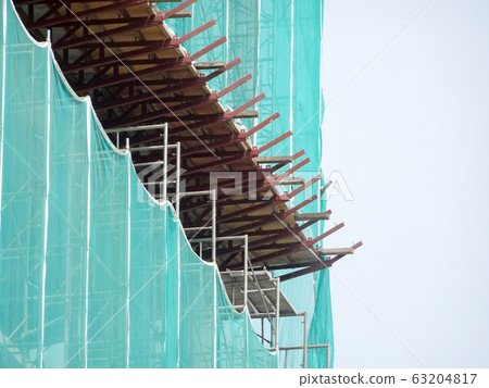 Catch platform or other construction projection from the face of a building. It is protect individuals and property from falling debris during construction.  63204817