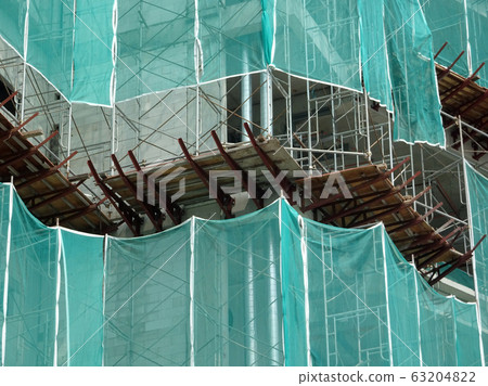 Catch platform or other construction projection from the face of a building. It is protect individuals and property from falling debris during construction.  63204822