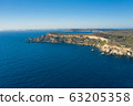 Aerial drone view of rocky coastline and sea. 63205358