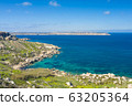 Aerial drone view of rocky coastline and sea. 63205364