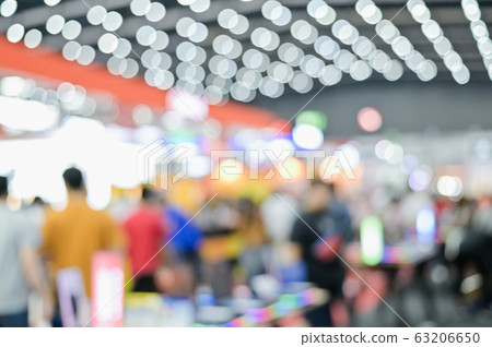 Blurred exhibit showcase background unspecific people Shop in grand sale fair and showcase advertisement 63206650