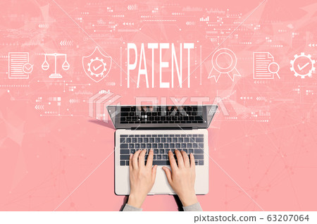 Patent concept with person using laptop 63207064