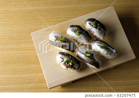 A handful of roasted herring A handful of roasted herring 63207475