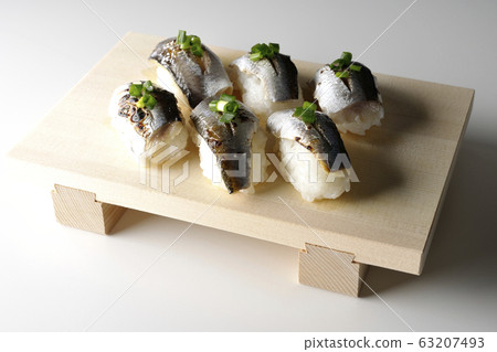 A handful of roasted herring 63207493