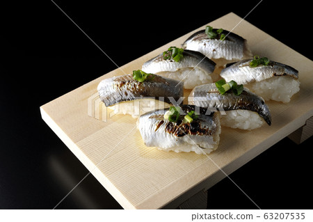 A handful of roasted herring 63207535