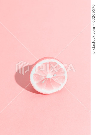 Funny pink monochrome lemon half with seeds. Funny pink monochrome lemon half with seeds. 63209576
