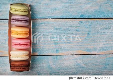 Macaroni cookies of different colors in a box on a Macaroni cookies of different colors in a box on a 63209655